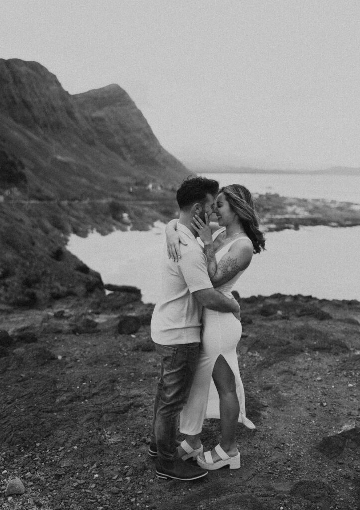 couples posing for their engagement photos in hawaii
