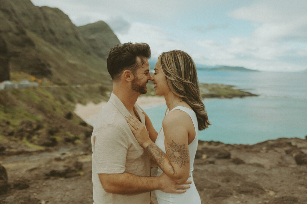 couples posing for their engagement photos in hawaii