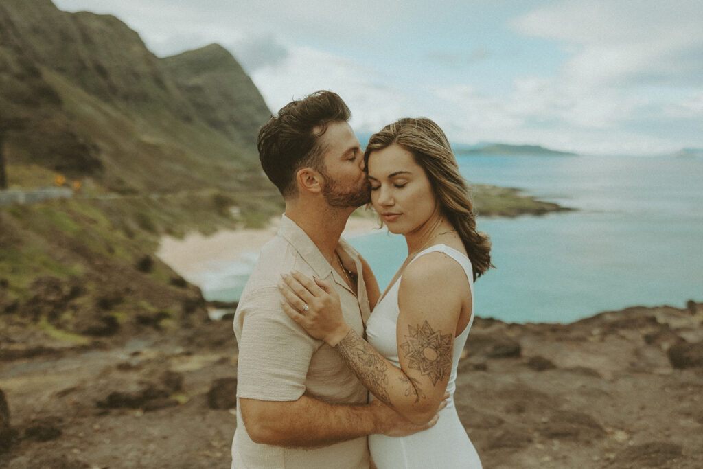 couples posing for their engagement photos in hawaii