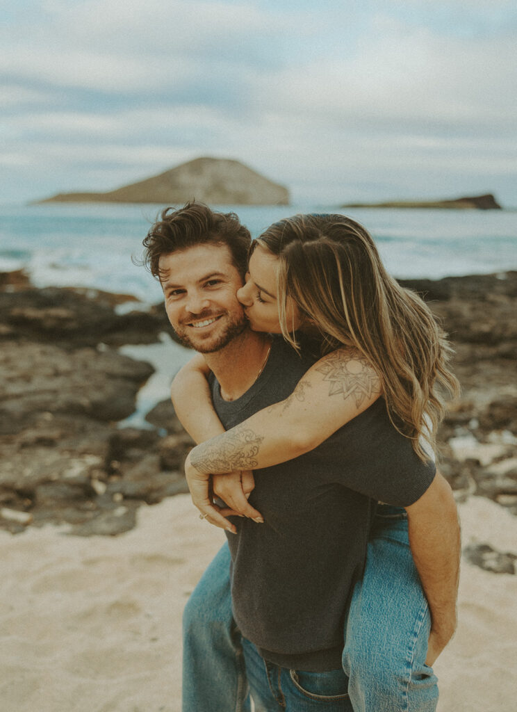 couples posing for their engagement photos in hawaii