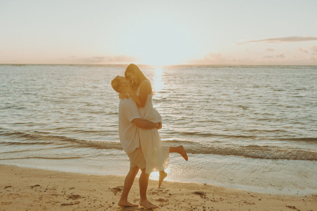 a couple posing for their engagement photos in hawaii
