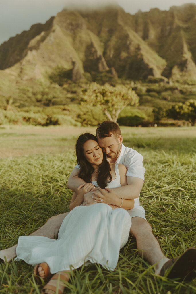 a couple posing for their engagement photos in hawaii
