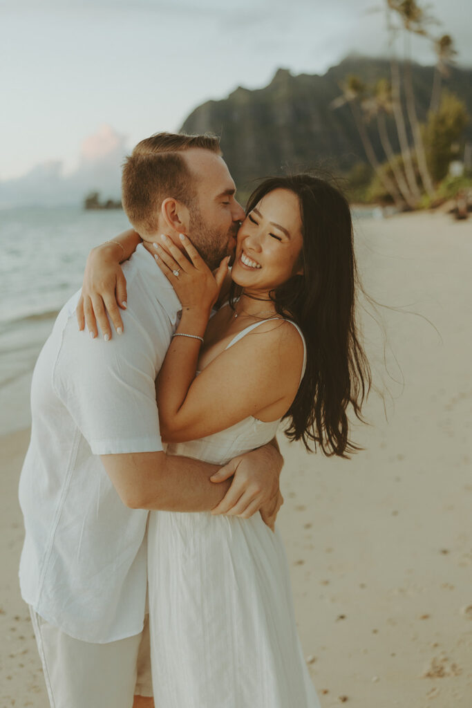 a couple posing for their engagement photos in hawaii
