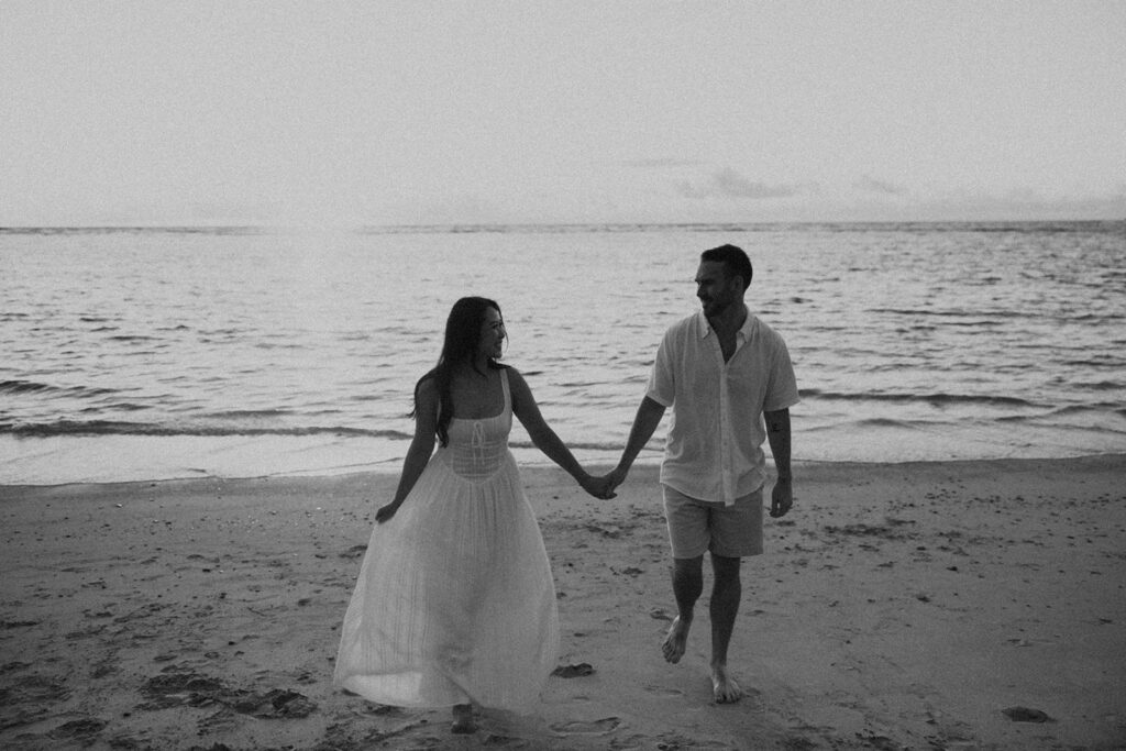 a couple posing for their engagement photos in hawaii