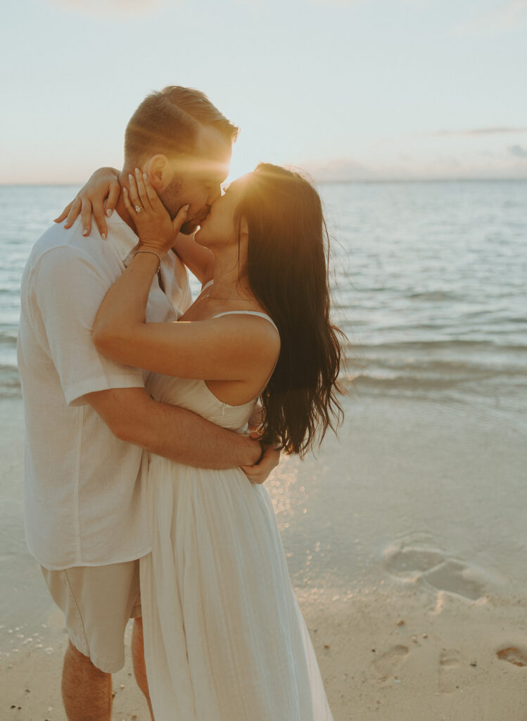 a couple posing for their engagement photos in hawaii
