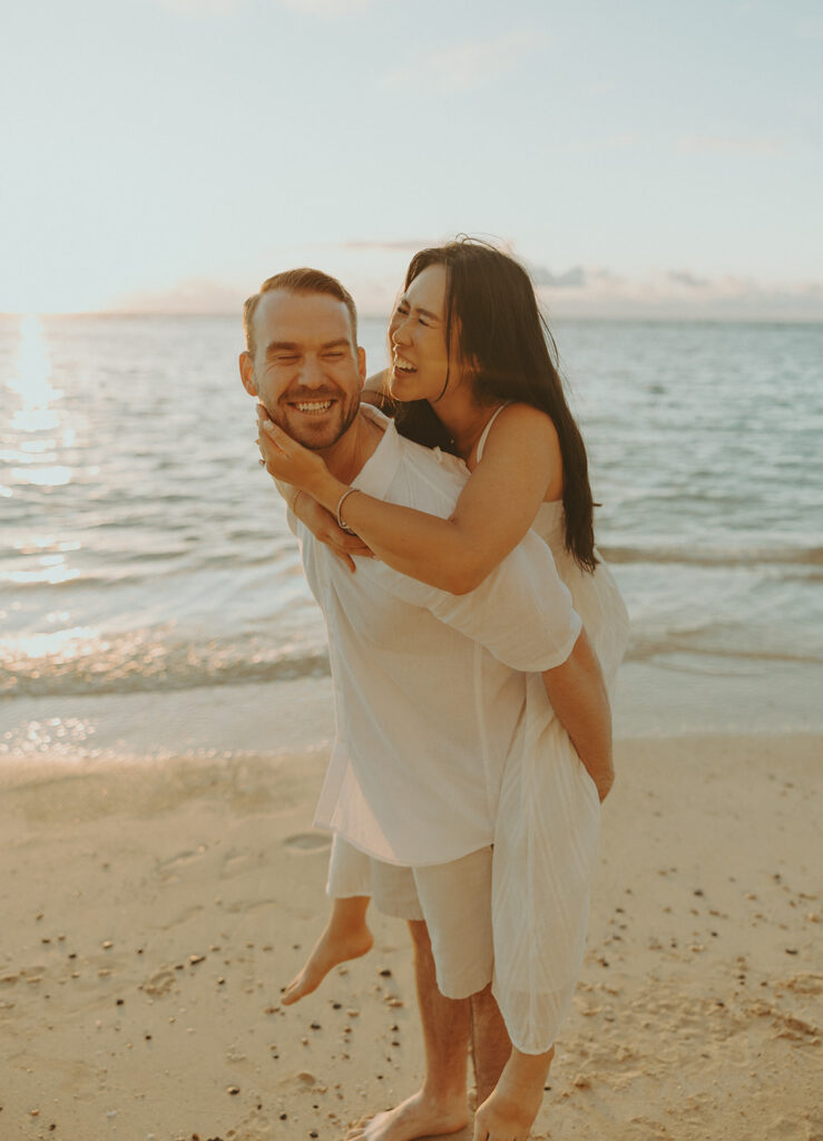 a couple posing for their engagement photos in hawaii
