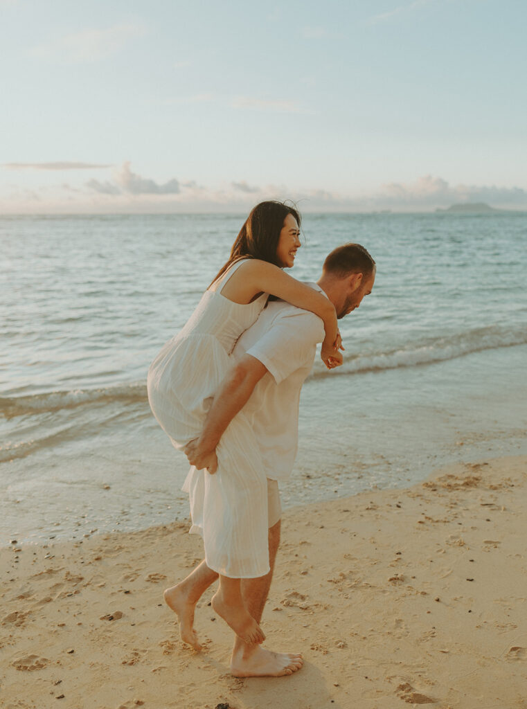 a couple posing for their engagement photos in hawaii
