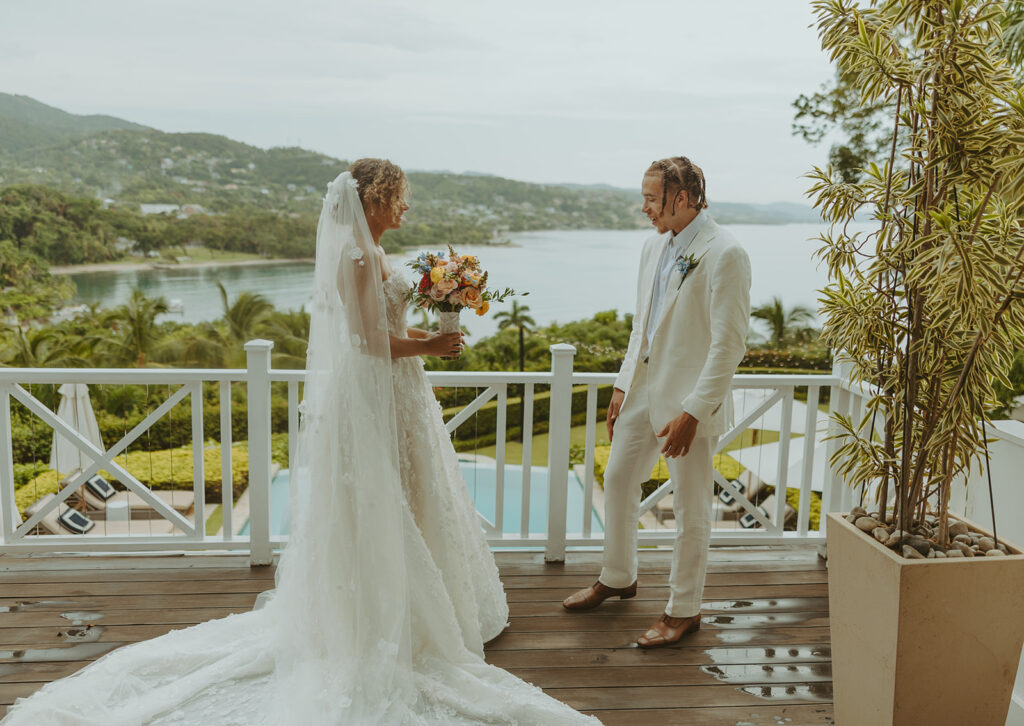 A romantic destination wedding ceremony overlooking the ocean in Jamaica
