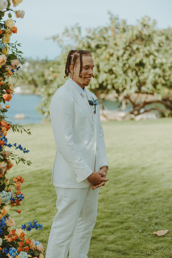 A romantic destination wedding ceremony overlooking the ocean in Jamaica