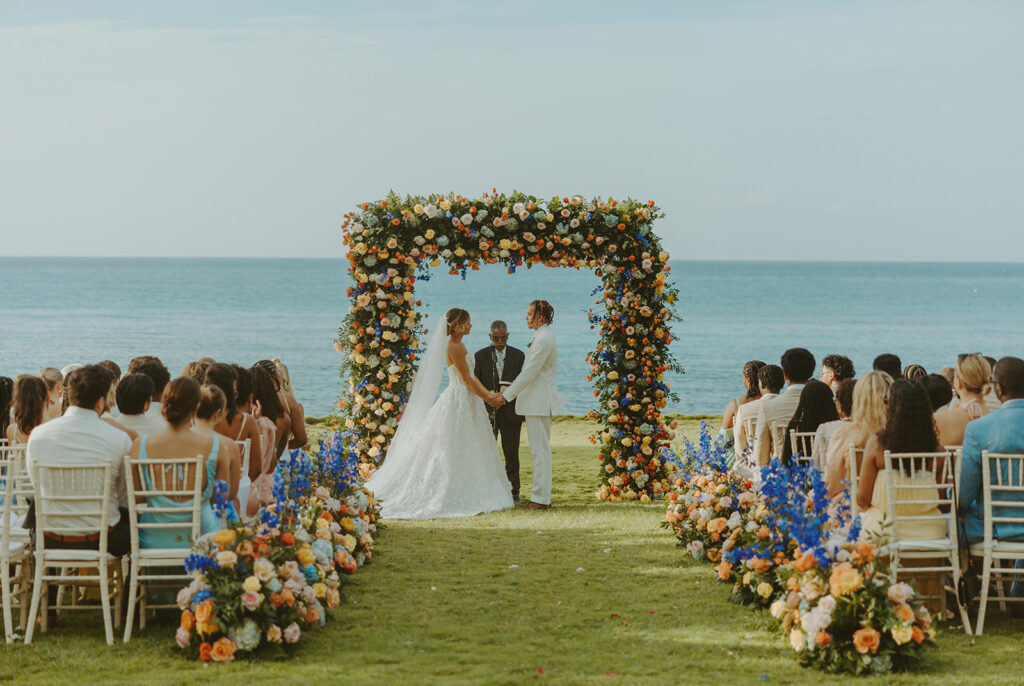 A romantic destination wedding ceremony overlooking the ocean in Jamaica
