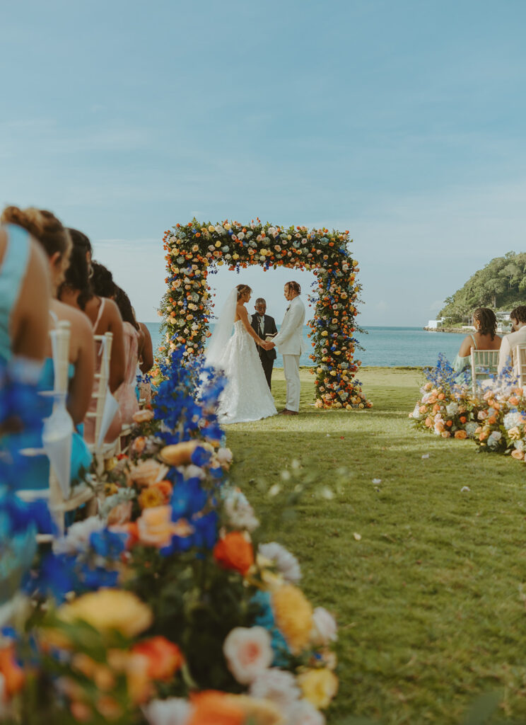 A romantic destination wedding ceremony overlooking the ocean in Jamaica
