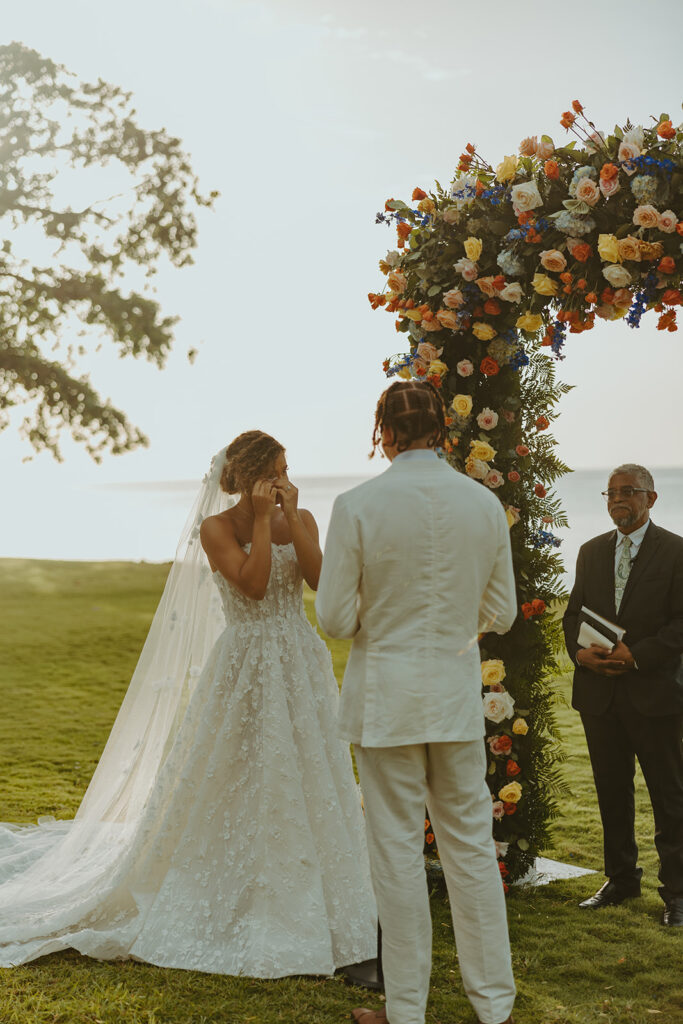 A romantic destination wedding ceremony overlooking the ocean in Jamaica
