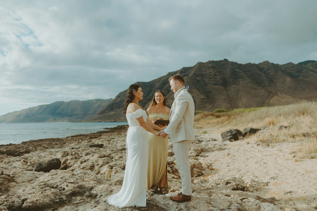 Officiant leading a personalized wedding ceremony on the beach in Hawaii

