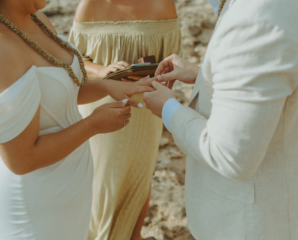 Couple exchanging vows during an Oahu elopement ceremony
