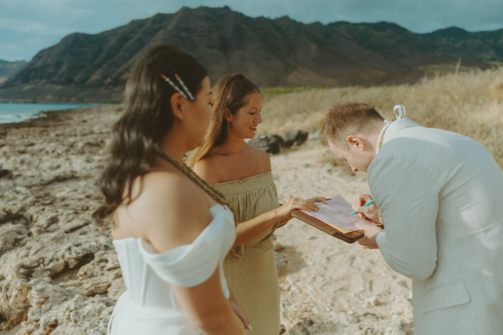 Couple exchanging vows during an Oahu elopement ceremony
