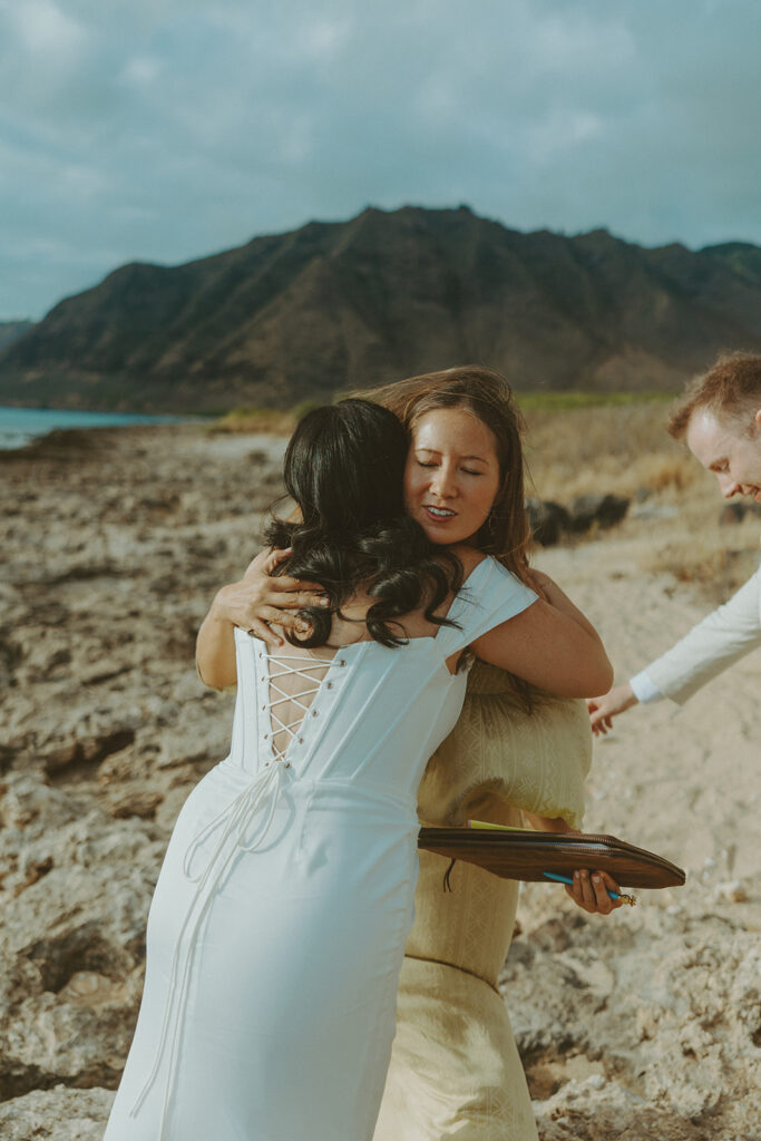 Officiant leading a personalized wedding ceremony on the beach in Hawaii
