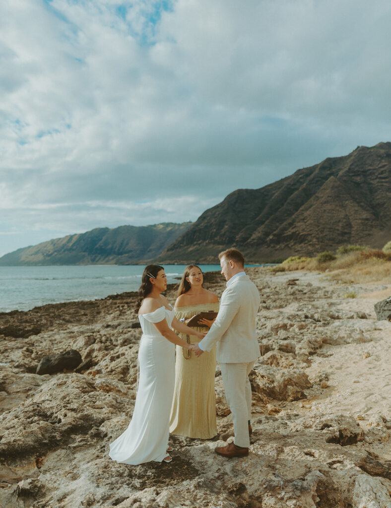 Officiant leading a personalized wedding ceremony on the beach in Hawaii
