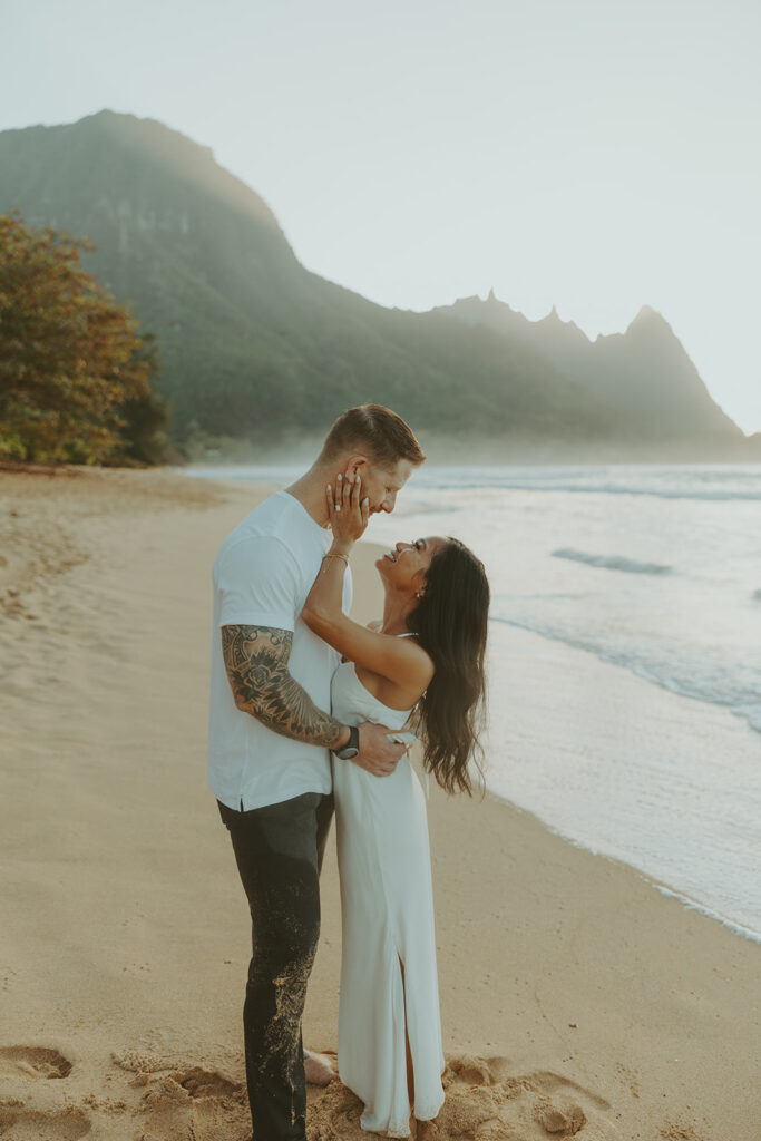 Man proposing to his girlfriend on the beach in Kauai