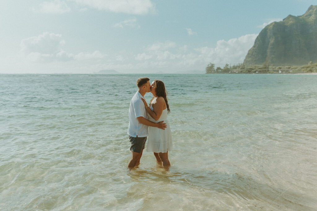 Nicole and Nicholas sharing a joyful moment after the surprise proposal in Oahu.
