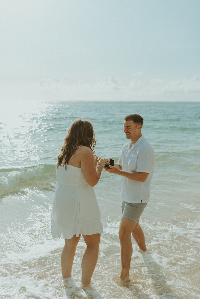 Emotional reaction as Nicole says yes during the surprise proposal photoshoot.
