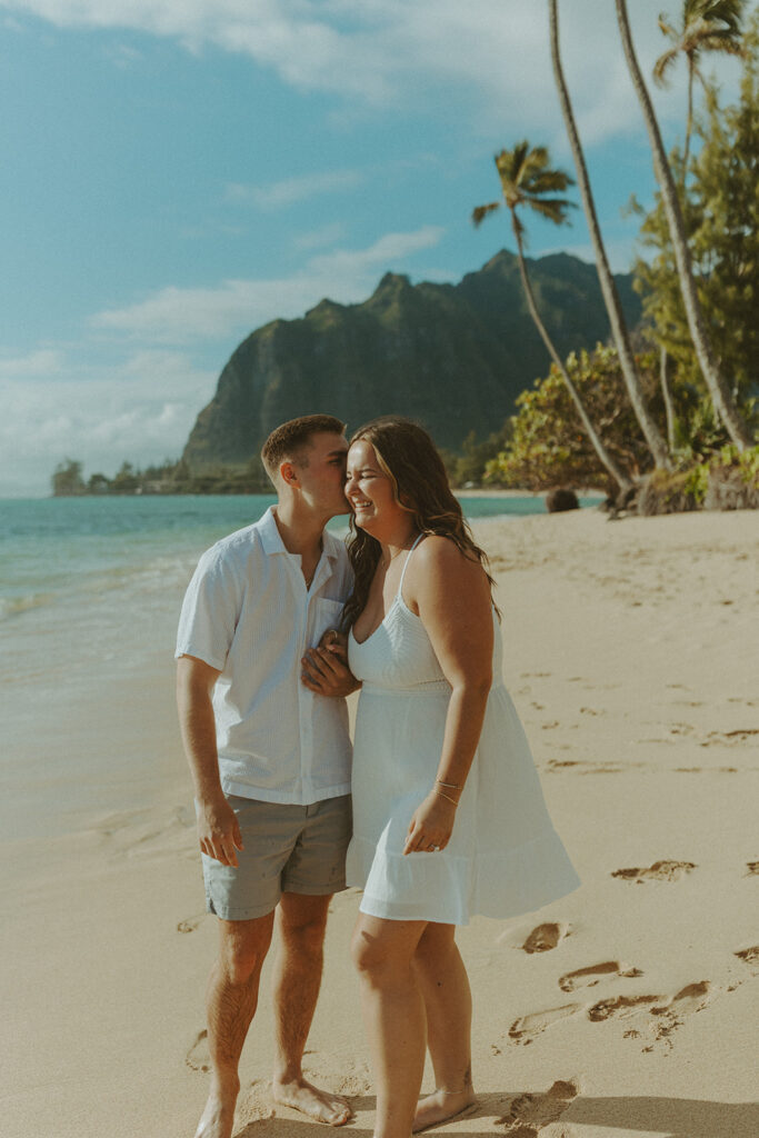 Nicole and Nicholas sharing a joyful moment after the surprise proposal in Oahu.
