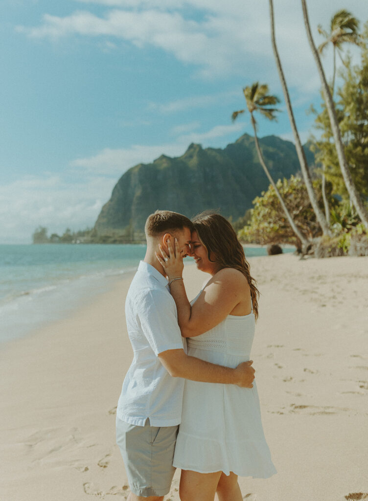 Nicole and Nicholas sharing a joyful moment after the surprise proposal in Oahu.

