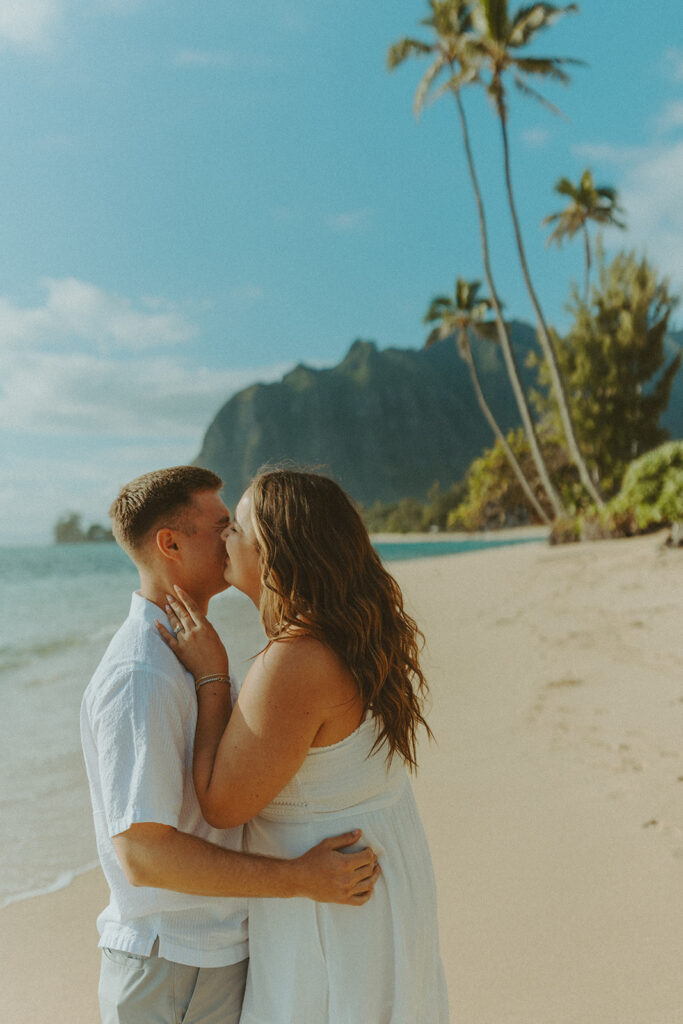 Nicole and Nicholas sharing a joyful moment after the surprise proposal in Oahu.

