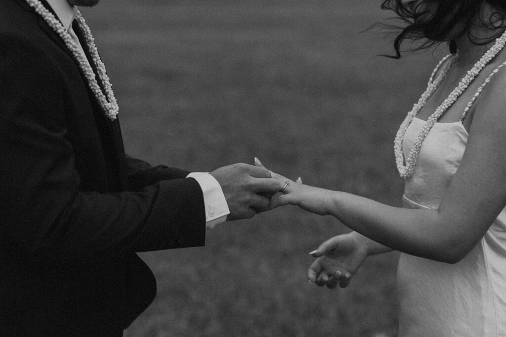 Elopement ceremony at Kualoa Regional Park with tropical floral details

