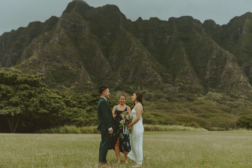 Elopement ceremony at Kualoa Regional Park with tropical floral details
