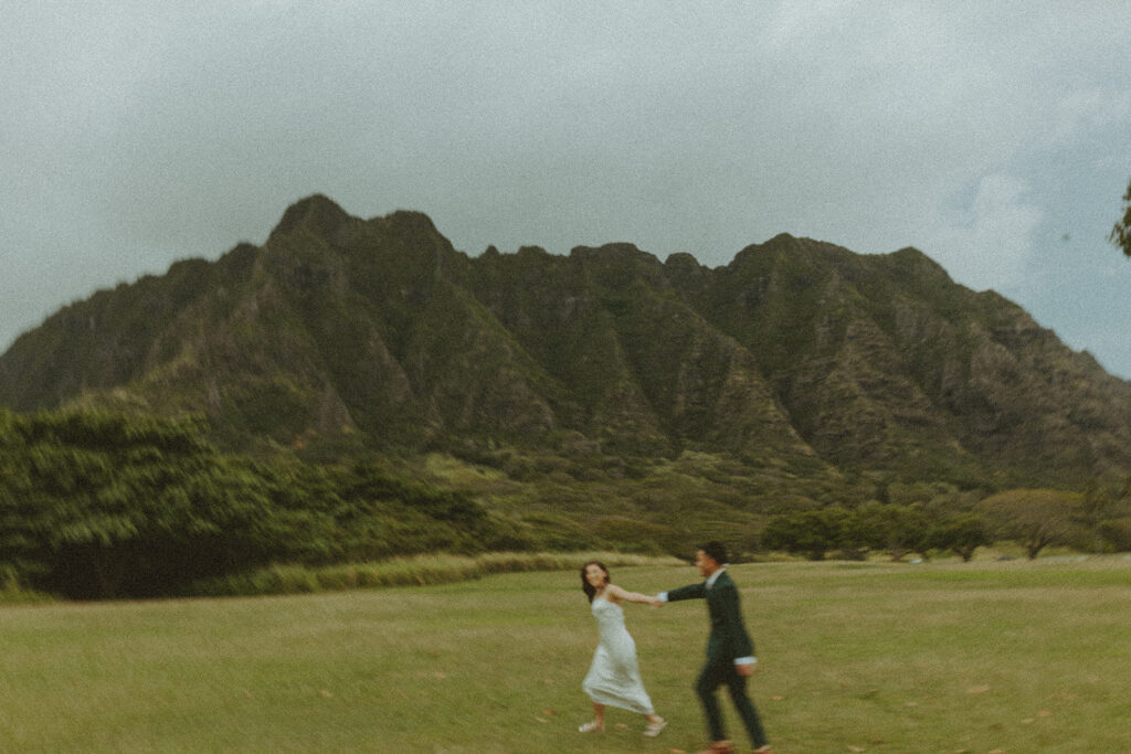 Elopement ceremony at Kualoa Regional Park with tropical floral details