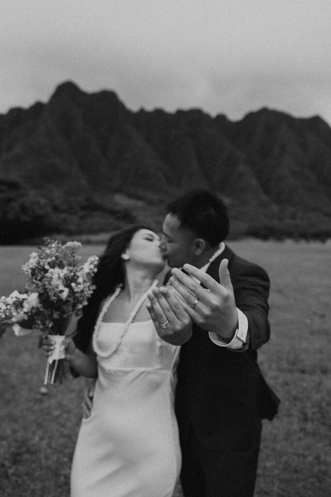Elopement ceremony at Kualoa Regional Park with tropical floral details
