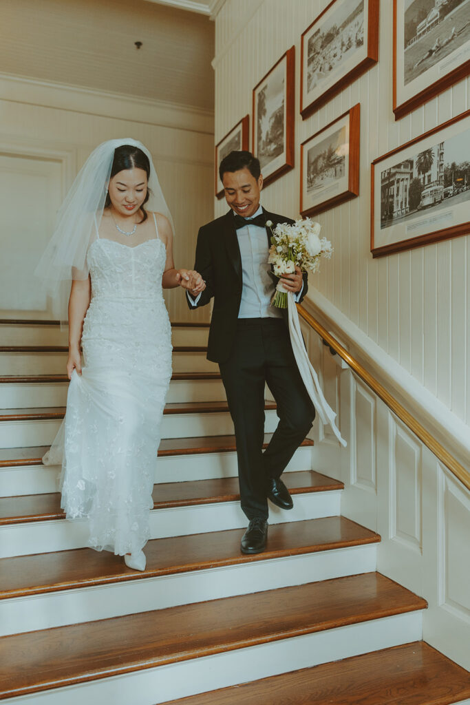 Groom and the bride on a terrace with ocean views at Moana Surfrider
