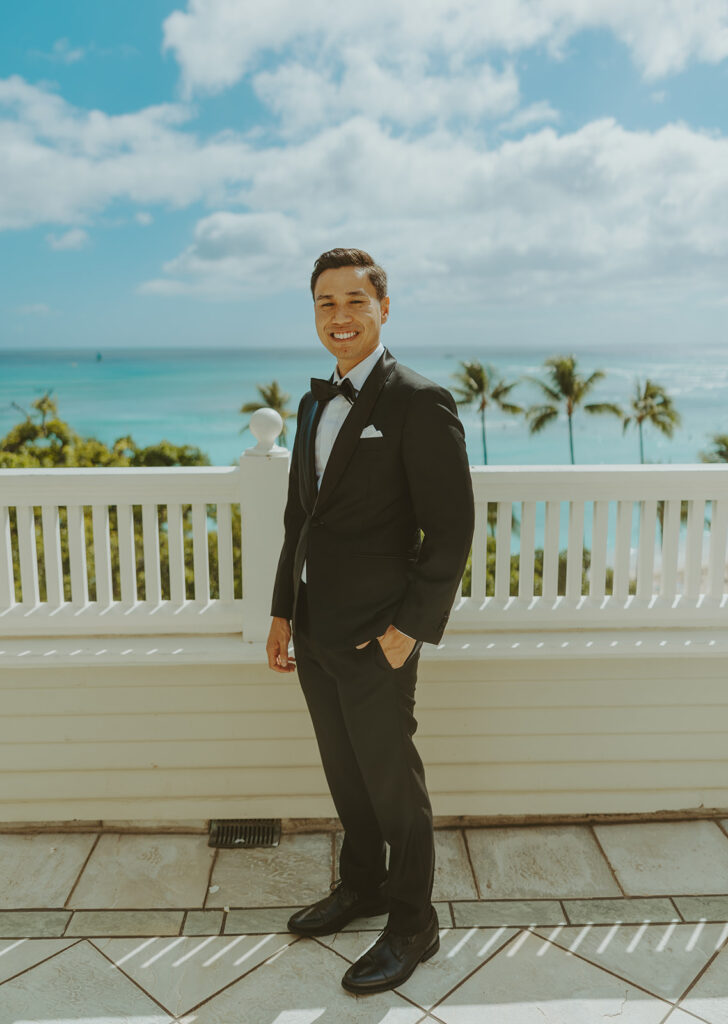Groom and the bride on a terrace with ocean views at Moana Surfrider
