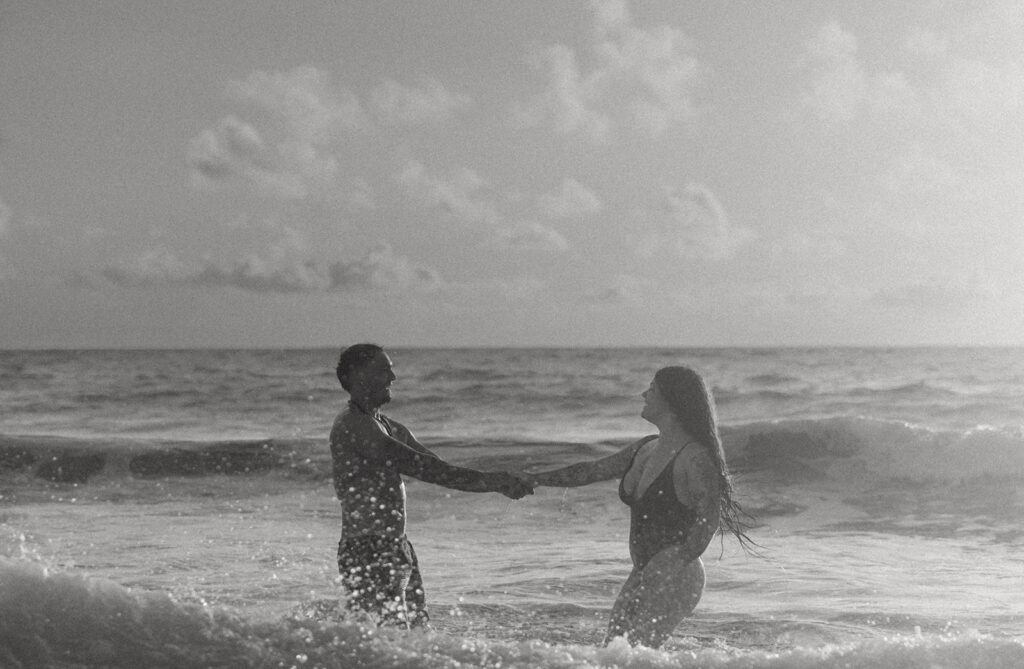 Intimate ocean photos of couple enjoying a Hawaii sunrise photoshoot
