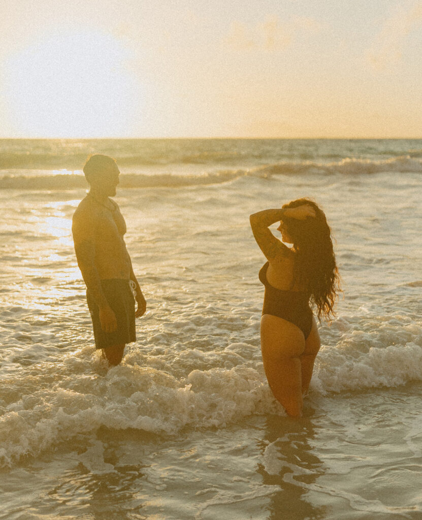 Intimate ocean photos of couple enjoying a Hawaii sunrise photoshoot

