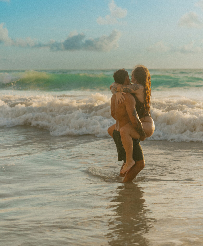 Intimate ocean photos of couple enjoying a Hawaii sunrise photoshoot
