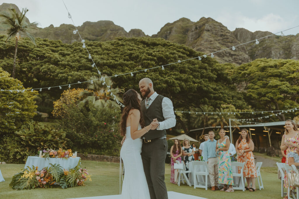 Wedding ceremony setup at Paliku Gardens surrounded by tropical greenery.
