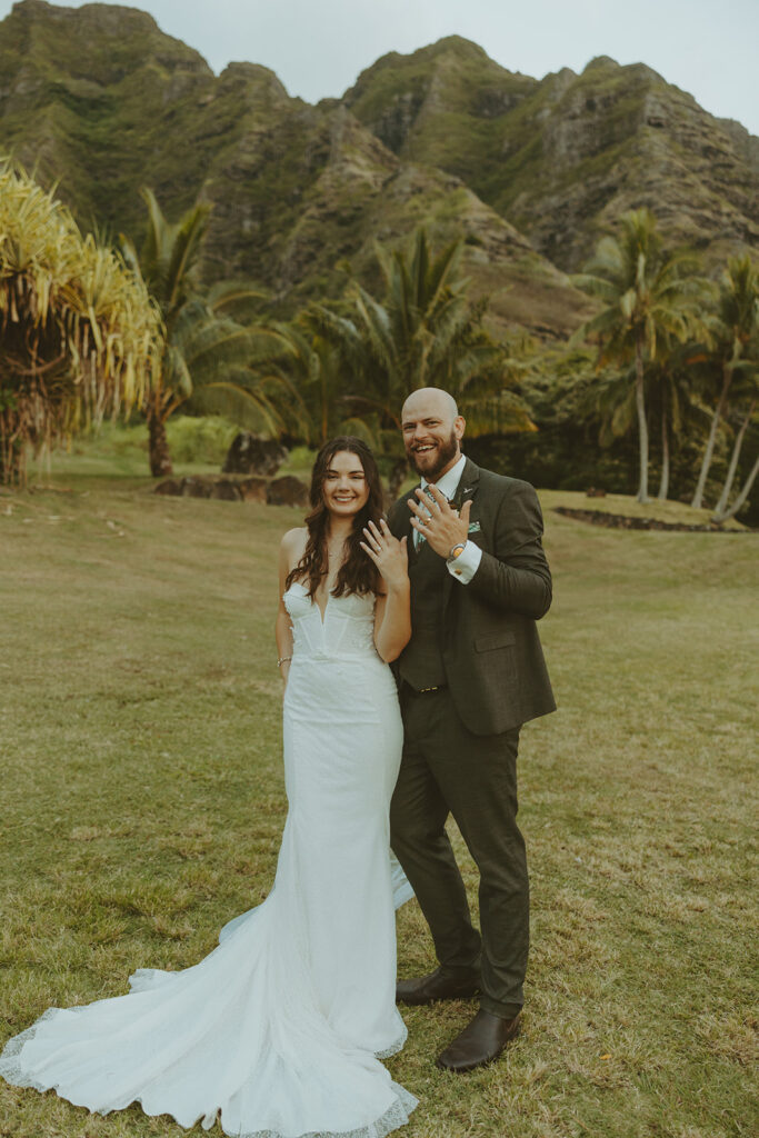 Bride and groom sharing a quiet moment during sunset portraits at Kualoa Ranch.