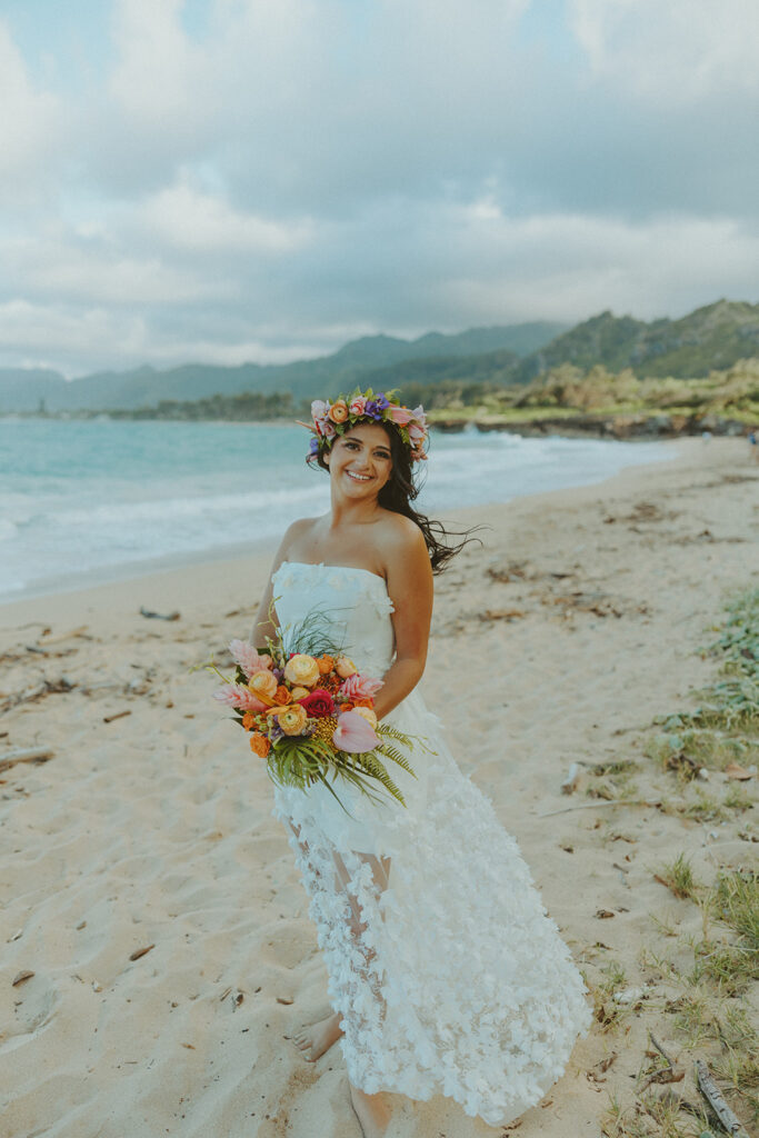 Couple exchanging vows during an intimate North Shore elopement ceremony on the beach.
