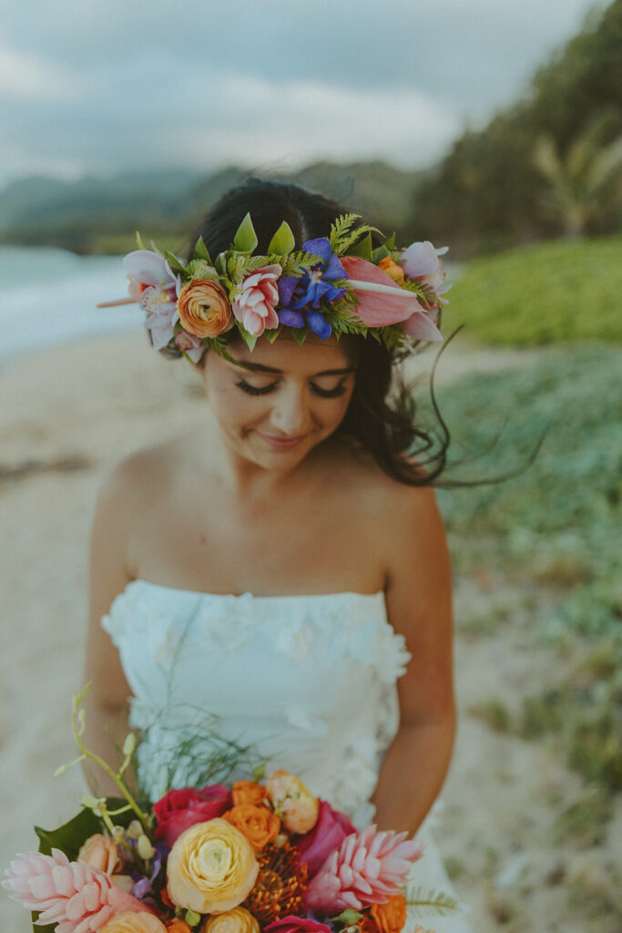 Romantic beach portraits of the couple surrounded by tropical scenery.
