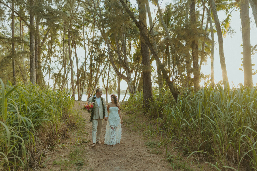 Newlyweds exploring a lush jungle location near Turtle Bay Resort after their ceremony.
North Shore Elopement in Oahu