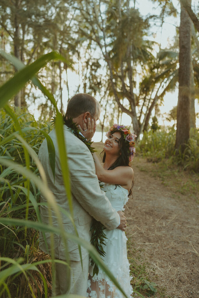 Newlyweds exploring a lush jungle location near Turtle Bay Resort after their ceremony.
