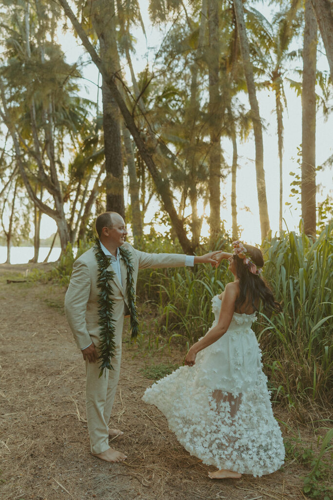Newlyweds exploring a lush jungle location near Turtle Bay Resort after their ceremony.