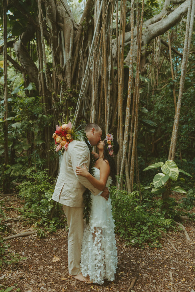 Newlyweds exploring a lush jungle location near Turtle Bay Resort after their ceremony.
