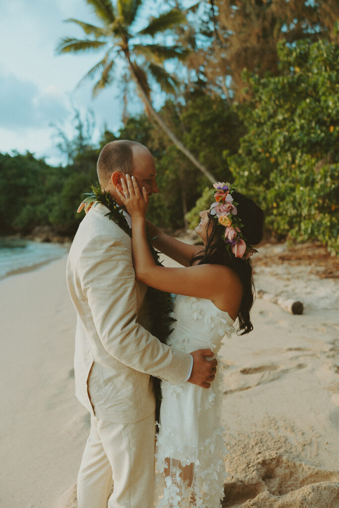 Sunset walk along the North Shore beach with golden light reflecting on the water.
North Shore Elopement in Oahu