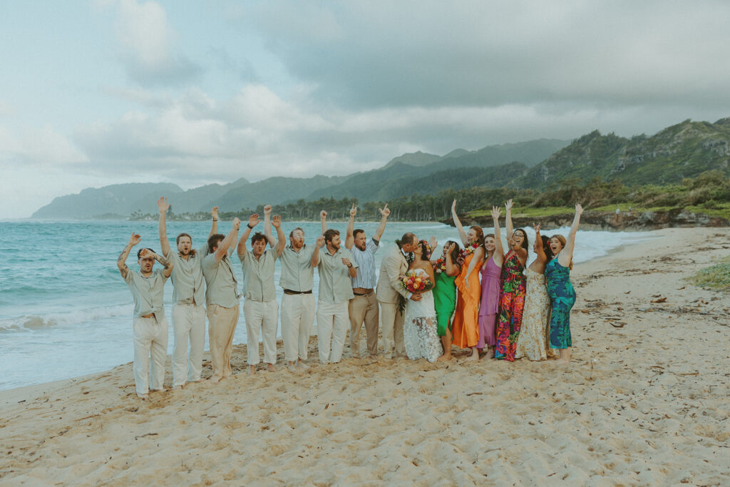 Couple exchanging vows during an intimate North Shore elopement ceremony on the beach.
