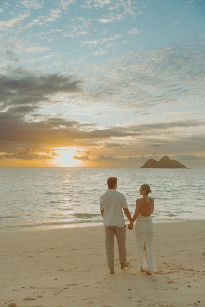 Peaceful early morning beach scene with soft pastel skies and gentle waves
