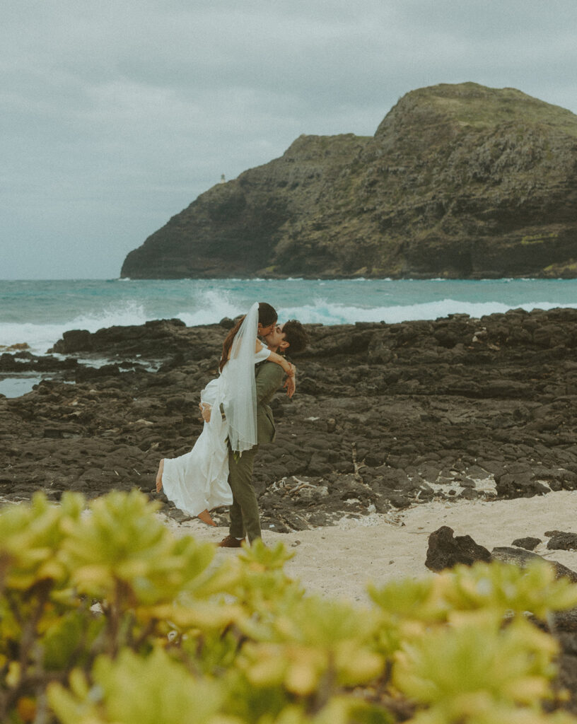 Wedding portraits taken in the mountains at Kualoa Ranch Jurassic Valley
