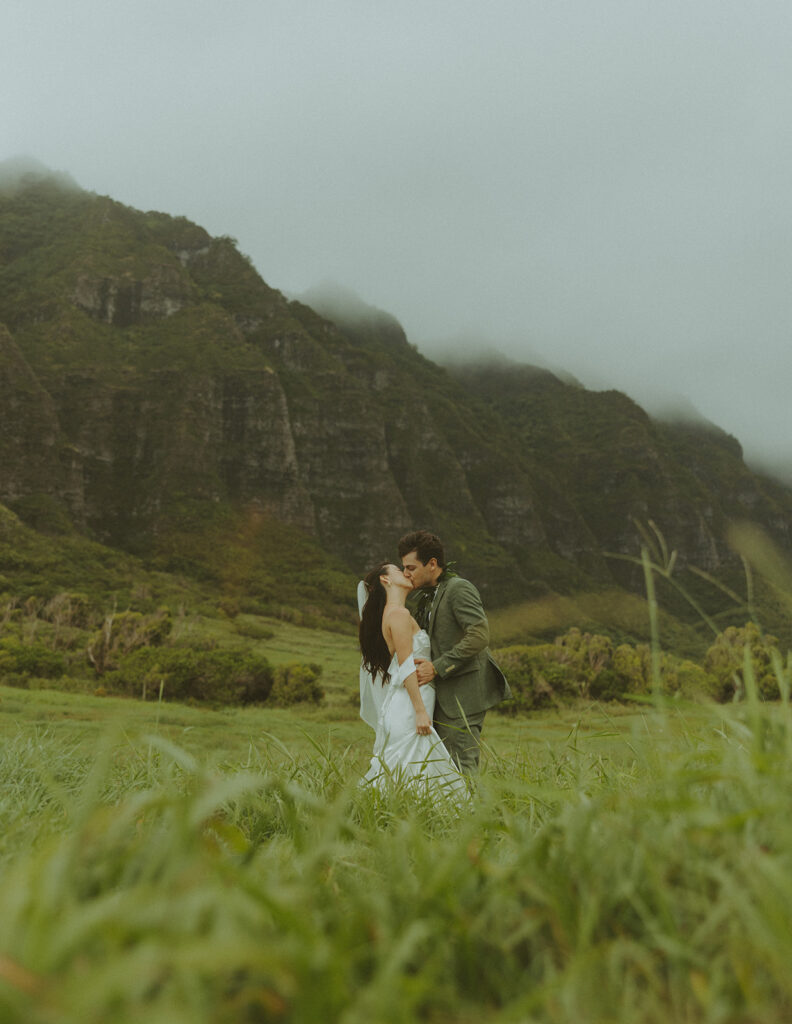 Couple standing together during their Makapuu Beach ceremony
