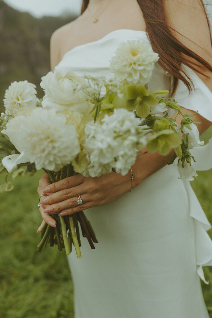Couple standing together during their Makapuu Beach ceremony
